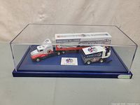 Full set in acrylic case showing hauler, Zamboni and packaging insert
