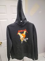 Full front view of hoodie with front graphic and pocket