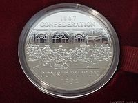 Reverse of 1982 Confederation Constitution dollar coin in capsule
