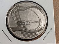 Obverse side of 2011 Rick Hansen 25th Anniversary Canadian coin in flip