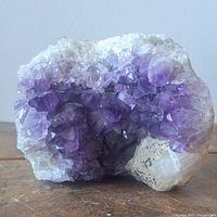 Front view of amethyst crystal cluster showing purple points and white matrix
