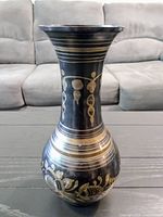 Front view of vase showing overall shape and etched design