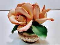 Front view of porcelain rose figurine