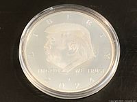 Obverse of coin showing Donald Trump profile, inscriptions and year