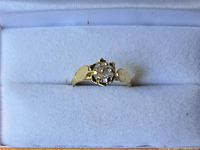 Ring top view showing stone and gold-tone setting