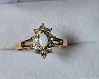 Top view showing opal center and surrounding clear stones