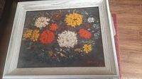 Frontal view of framed floral oil painting