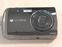 Front view showing Norcent XIAS camera body and Pentax lens