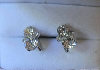 Front view showing three-stone rhinestone clusters on each earring