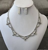 Full view of rhinestone necklace on display bust