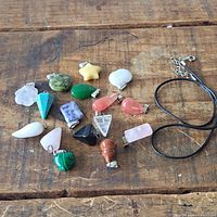 All pendants and cord displayed on wooden surface