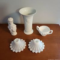 Group shot front view of all five white decorative pieces