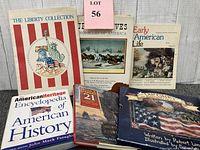 Photo of six American history and heritage themed books and magazines arranged on a white canvas background