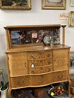 Front view showing buffet and mirrored hutch