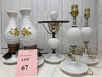 Front view of the set of four vintage milk glass hobnail lamps showing details of hand-painted floral accents and shiny pink lot card