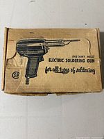 Original cardboard box for Mastercraft electric soldering gun with printed illustration and text.