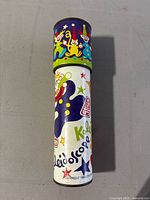 Front view of vintage kaleidoscope showing clown graphics and brand logo Stephen.
