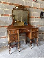 Front view of vanity dresser with mirror