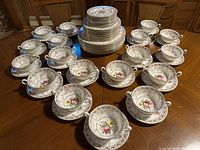 Full arrangement of all cups, saucers, plates and bowls on table
