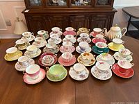 Overhead view of assortment of tea cups and saucers