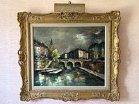 Frontal view of framed oil painting with attached picture lamp showing overall style and condition