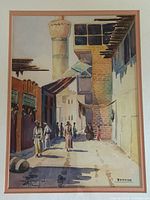 Close view of painted street scene with minaret