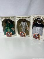 Three Gone With the Wind dolls in original boxes showing Scarlet, Rhett, and Mammy dolls side by side.
