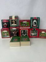 Front view of the collection with all boxes and books displayed showing various Hallmark Keepsake ornaments boxed and labeled.