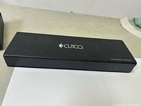 Black rectangular Cutco branded case closed.