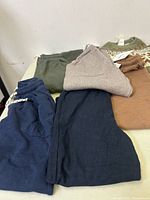 All six new boys clothing items from Zara laid out, showing various colors and fabrics.