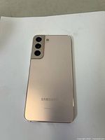 Back view showing triple camera setup, flash, and color finish