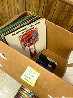 Box with records, showing 'The Staple Singers Curtis Mayfield Let's Do It Again' album front cover