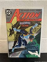 Front cover image of Action Comics #613 showing Nightwing, with DC logo, price, and comic details.