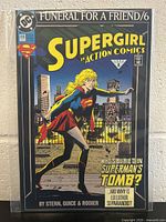 Front cover of Action Comics #686 showing Supergirl near Superman's tomb with cityscape background, comic title and logos clearly visible.