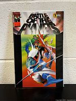 Photo showing the front cover of the comic book 'Battle Of The Planets #1' with clear view of the title and characters in colorful costumes.