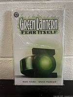 Front cover of Green Lantern Fear Itself hardcover graphic novel, sealed in plastic bag showing mint condition.