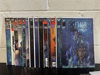 Photo showing 14 Fathom comic books from Michael Turner in near mint condition.