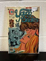 Front cover of Secrets Of Young Brides comic book issue #3 showing illustrated romantic scene and publication info