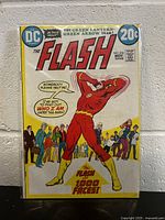 Front cover photo of The Flash #218 comic book showing The Flash in red costume with the title and pricing details.