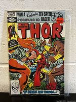 Front cover of The Mighty Thor #316 comic book showing Iron Man and large beasts, with price and publication details.
