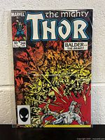 Front cover of The Mighty Thor #344 comic book showing vibrant battle scene and issue details.