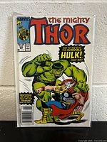 Front cover of The Mighty Thor #385 comic book showcasing Hulk and Thor fighting, published by Marvel Comics.