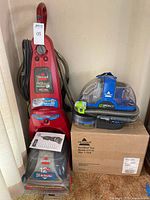 Front view of both carpet cleaners upright and portable