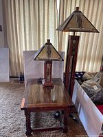 Floor and table lamps atop side table