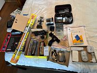 Full lot layout showing scanner, antenna tube, remote, GoPro kit, lights, hard drive, recorder, power bank