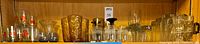 Shelf with full assortment of glasses