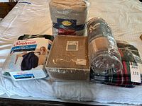 Group shot of all blankets showing packaging and colours