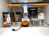Overall lot showing boxed Quick Chop, deep fryer, handheld blender, pie maker, chopper jar