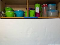 Overview of colorful plastic containers on shelf