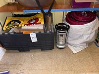 Sleeping bag, lantern and storage tote overview